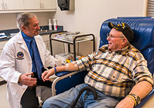 Dr. W. Timothy Garvey talks with Birmingham VA patient James “Lester” Hallman. (Photo by Joe De Sciose)