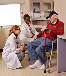 Dr. Rina Eisenstein (left) a primary care physician on the GeriPACT team at the Atlanta VA, talks with patient Henry Holley, who served in the Marines. With them is nurse care manager Cathy Woods. (Photo by Joey Rodgers) 