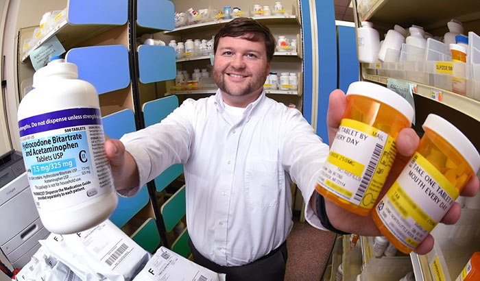 Pharmacist Dr. Corey Hayes and colleagues found that higher opioid doses did not bring more pain relief—but did increase the risk of harmful side effects. (Photo by Jeff Bowen) 