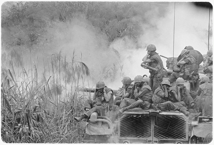 A new analysis of data from the Vietnam era found that lesbian, gay, and bisexual Veterans who served at the time are reporting PTSD and poorer mental health more often than their heterosexual counterparts. Here, Marines ride atop a tank during a road sweep near Phu Bai in central Vietnam. (Photo: National Archives)
