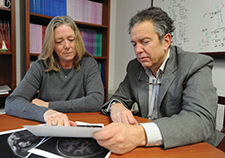 Drs. Regina McGlinchey and William Milberg, directors of VA's Translational Research Center for TBI and Stress Disorders (TRACTS), review MRIs. (Photo by Frank Curran)