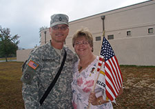 Cheryl Masevicius greets her husband, Rob, on his return from Iraq in October 2007, at Fort Dix.