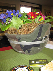 A flower arrangement in a military helmet, made to resemble the logo of Growing Veterans.  (Photo courtesy of Christopher Brown)