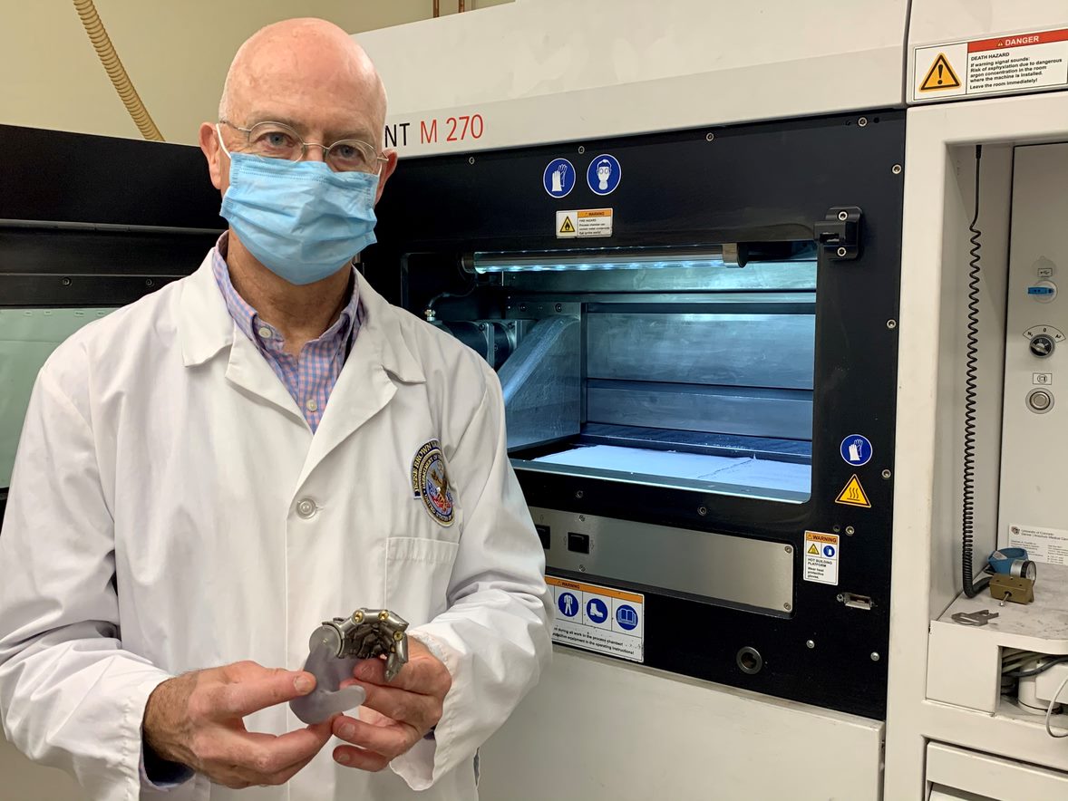 Dr. Richard Weir displays a prototype for one of his ongoing projects. It calls for developing a mechanical finger that can be sized for a female hand using 3D printing technology. (Photo by Terri Rorke)