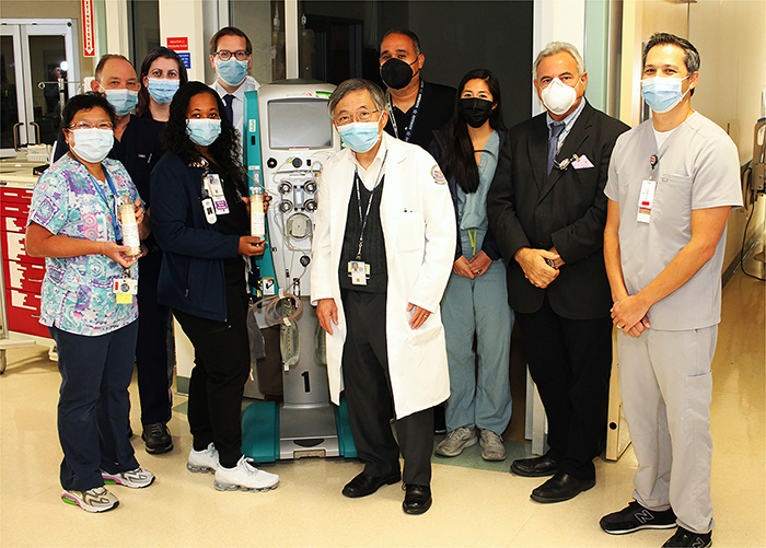  Dr. Michael Lewis and team members at the VA Greater Los Angeles medical intensive care unit (MICU) are shown with the Seraph filter. From left to right: Marlyn L. Lee, RN,  Gregory C. Johnson, RN, Mandana Rastegar, MD, Bridget Washington, RN, Michael Lewis, MD, Glenn T Nagami, MD, Jaime Betancourt, MD, Victoria Li, PA, Joseph R Pisegna, MD, and Joseph Moore, RN. Not pictured: Mai Pham, MD, Elham Ghadishah, MD,  Ruoxiang Wang, MD, PhD, Joseph Yusin, MD. (Photo by Scott Hathaway, VA Greater Los Angeles Healthcare System.)