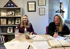 Research assistant Brandy Smith (left) and Behavioral Health QUERI program manager Krissi Morris are working with Dr. Sara Landes on a study evaluating REACH VET. On the shelves in the background are military memorabilia from Landes' family. (Photo by Sara Landes)  