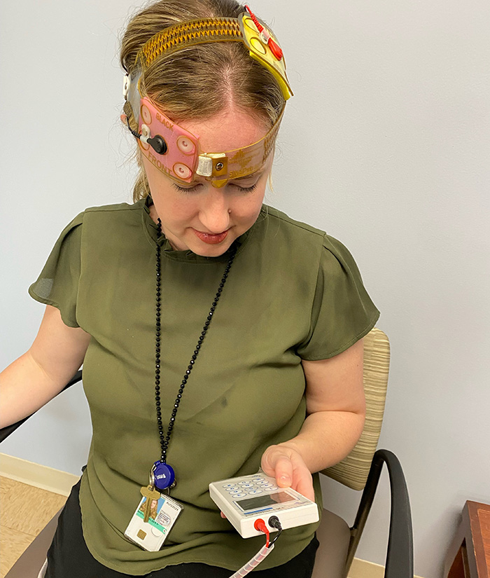  Research coordinator Chelsea Breen demonstrates how the tDCS device is used at the Ralph H. Johnson VA Medical Center in Charleston, South Carolina.