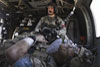 Army Sgt. Jesse Rosenfield, a flight medic with Task Force Thunder Brigade, tends to an injured soldier aboard a Blackhawk helicopter in Kandahar province, Afghanistan, in April 2011. VA and DoD experts are teaming up to drive new research on posttraumatic stress and traumatic brain injury, which affect significant numbers of Iraq and Afghanistan Veterans