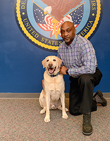 Army Veteran Derrick Tillman, VA's national dog trainer, is responsible for evaluating and approving each dog before it gets matched with a study participant.