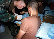  Owens (drawing blood from a fellow soldier in this photo) served as an Army medic.