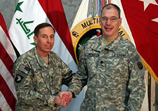 Russell (right) is pictured with Gen. David Petraeus, who commanded all coalition forces in Iraq in 2007 and 2008.  