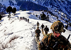 U.S. soldiers and Afghan border police hike along the Afghanistan-Pakistan border in early 2013. (U.S. Army Photo by Sgt. Jon Heinrich)	