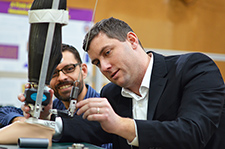  Dr. Patrick Aubin (right) working on a new lower limb prosthesis with team member Chris Richburg, research engineer.<em> (Photo by: Chris Pacheco, VA Puget Sound Health Care System) </em>