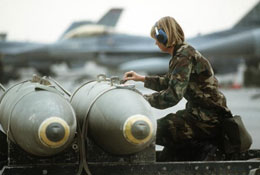 female soldier near fighter jet