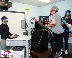 Exercise physiologists Kevin Mammino and Cydney Goodwin-Hamel assess a participant’s VO2 capacity. VO2max is a measurement of an individual’s ability to utilize oxygen during intense exercise. It is used as an indicator of cardiorespiratory fitness in many of the studies at the VA Center for Visual and Neurocognitive Rehabilitation. 
